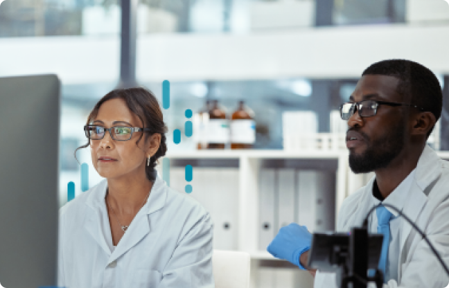 Two medical professionals collaborating on analysis in a lab setting